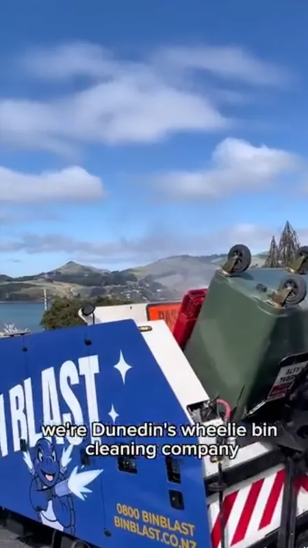 The Bin Blast truck loaded with bins above the Dunedin harbour